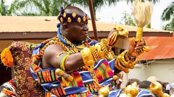 The Asantehene in ceremonial gold regalia during a royal Asante procession